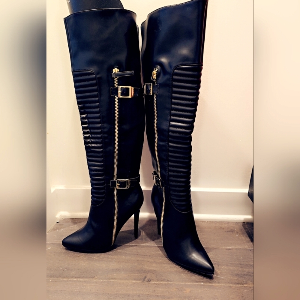 Black over the knees 4inch heel boots with gold zipper and buckles.